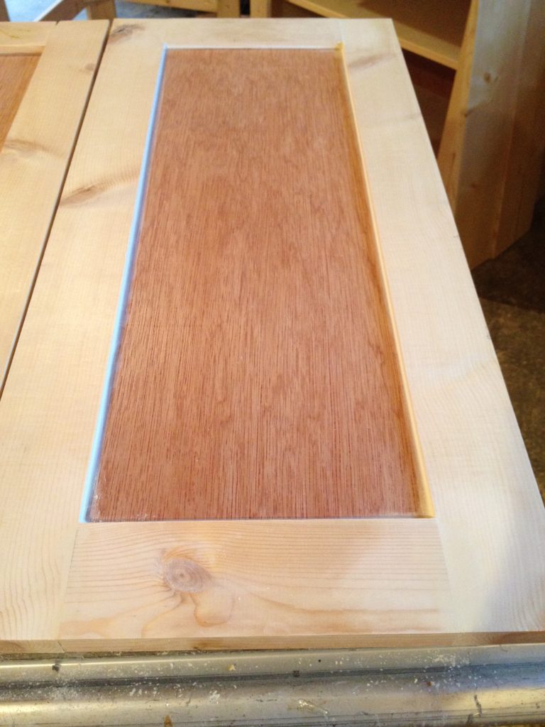 front of shaker cabinet doors caulked between inside panel and outside frames