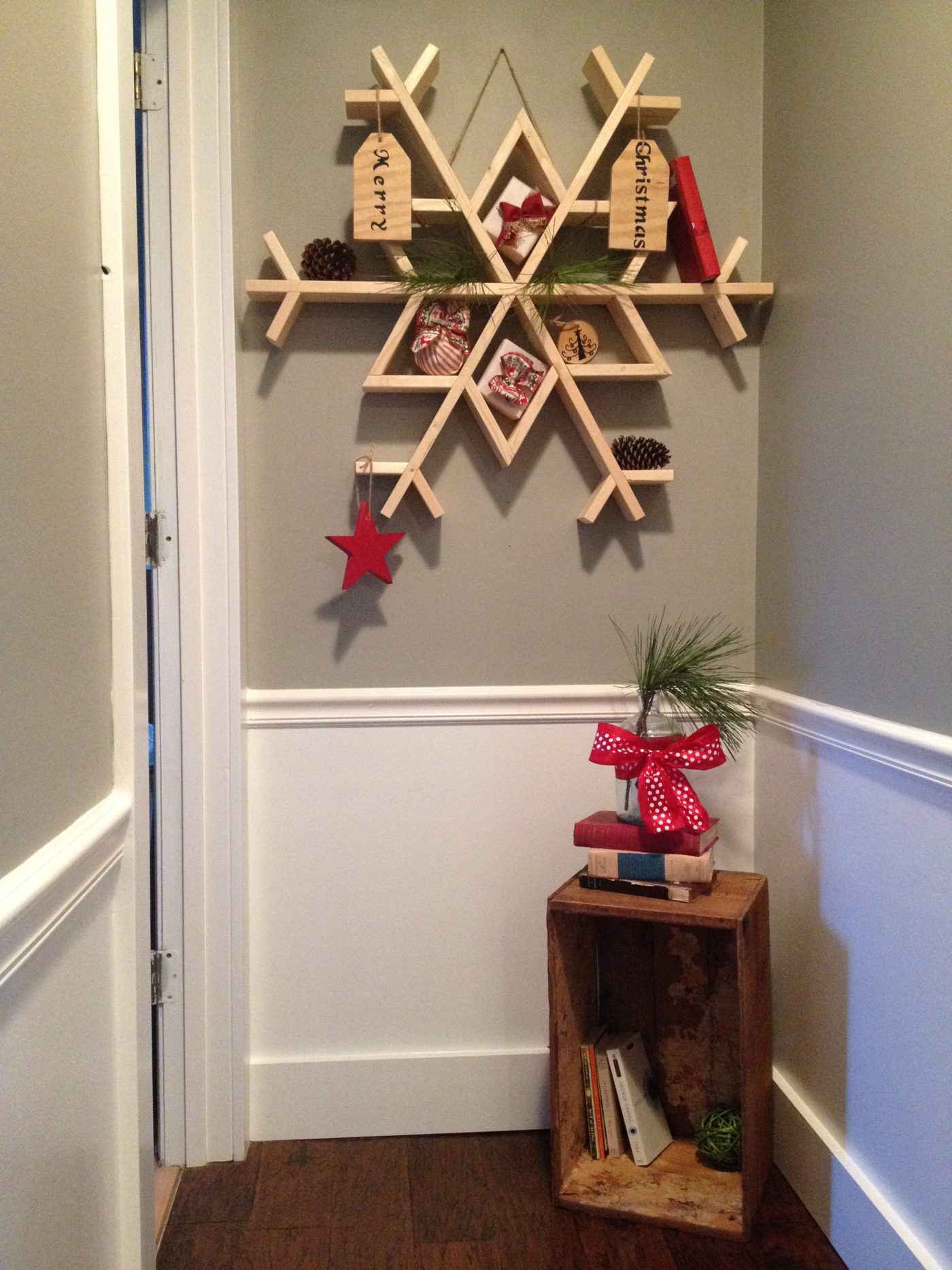 Large DIY snowflake shelf wall decor made from 1x4 boards