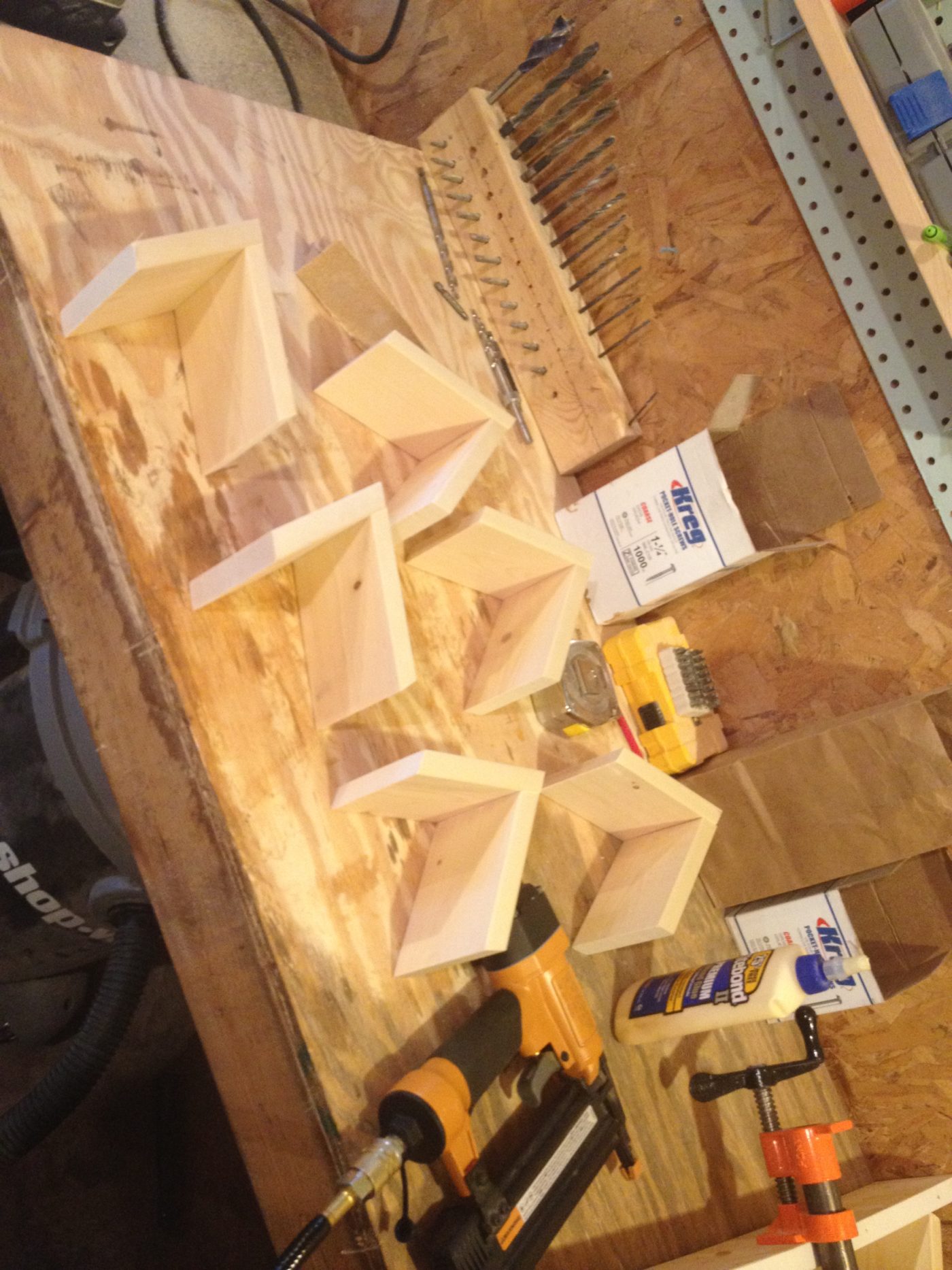 snowflake shelf sub assemblies laid out on workbench