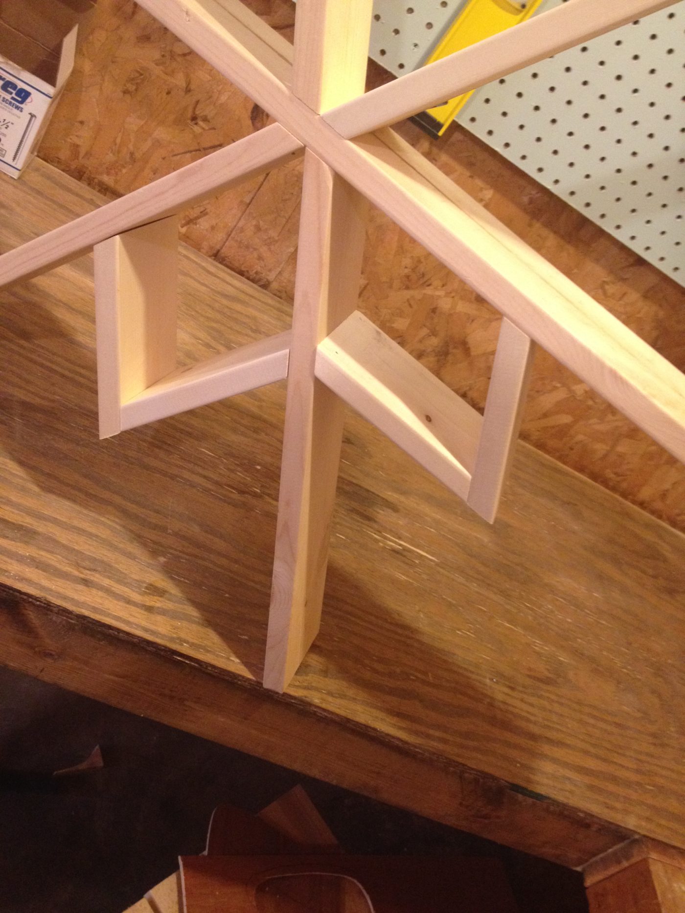 Close up of shelf triangles being installed onto shelf frame