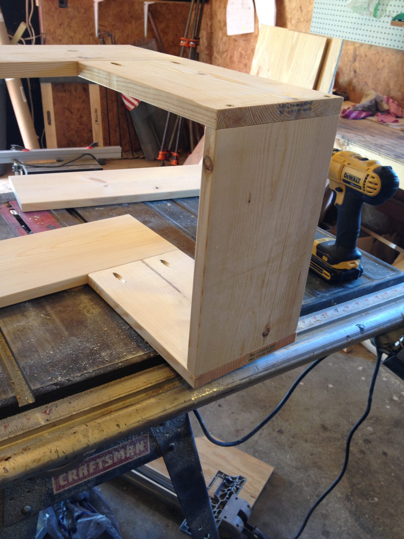 Final pieces of corner shelf screwed into short side