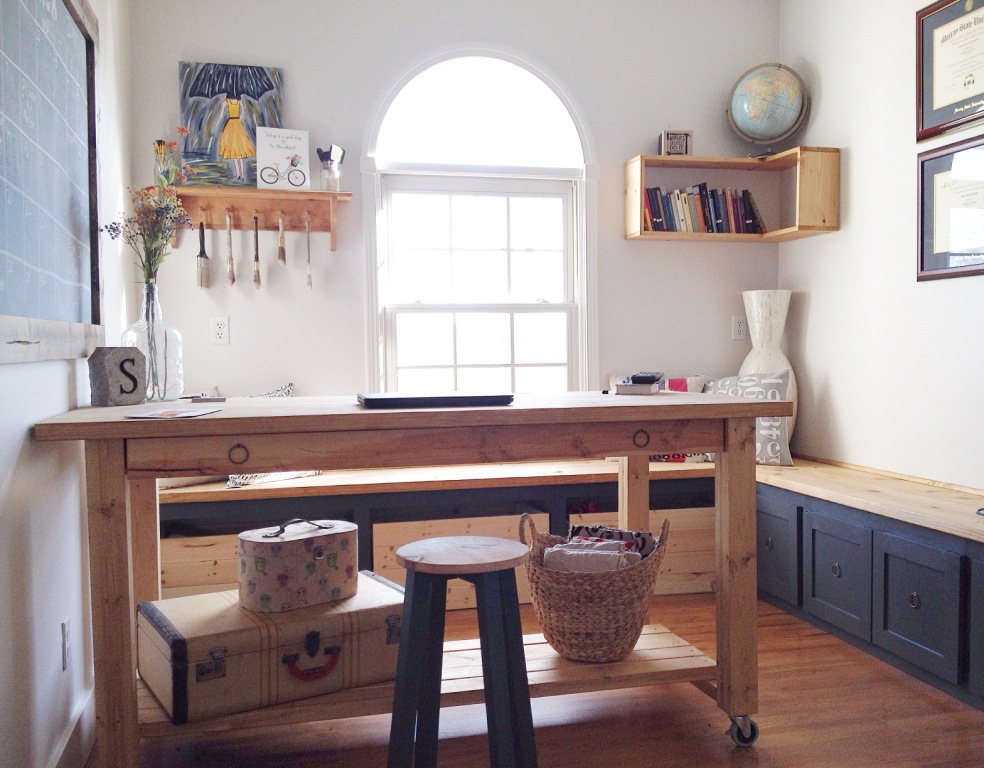 Home office with craft desk and built ins with DIY corner floating shelves on the wall