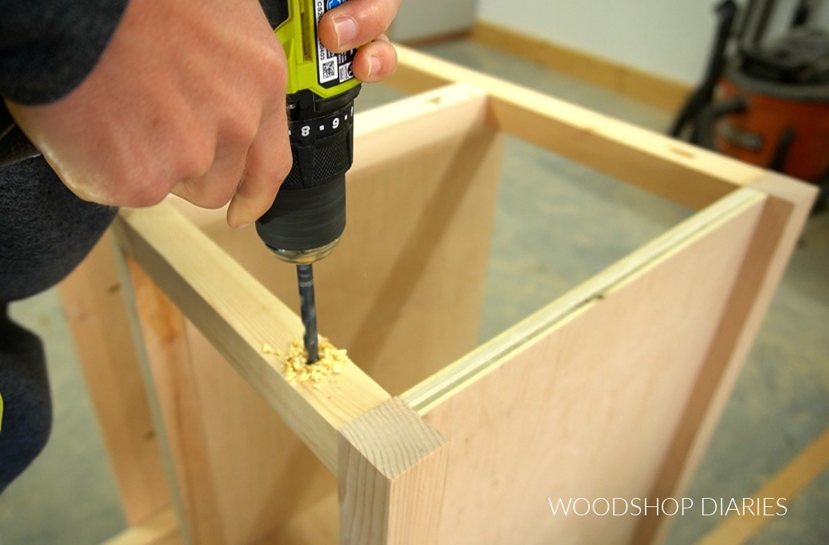 Drill drilling out oversized holes in 2x1 top framing pieces