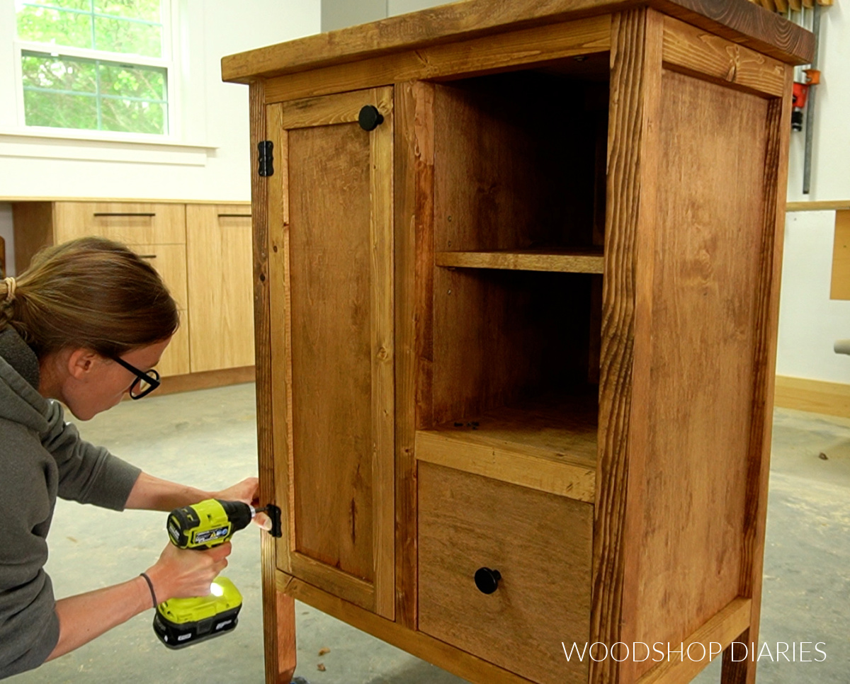 Shara Woodshop Diaries installing door onto cabinet using butt hinges