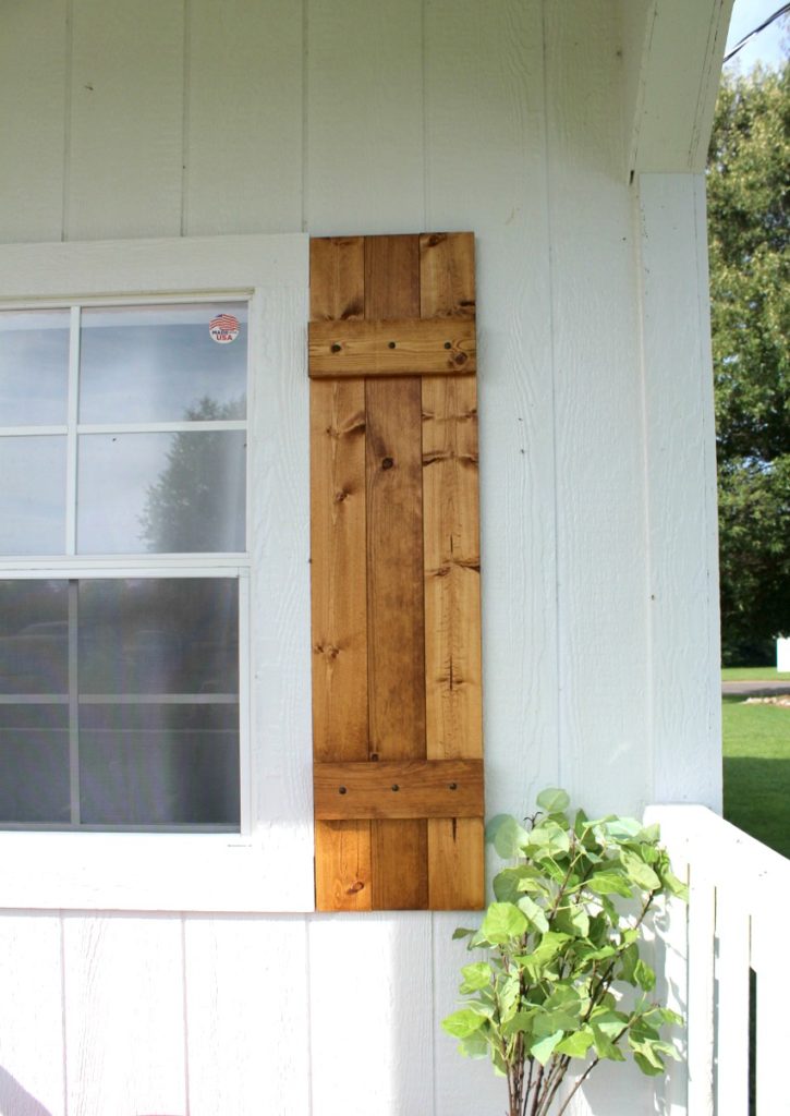 Close up of right side window shutter made from wooden 1x4 boards