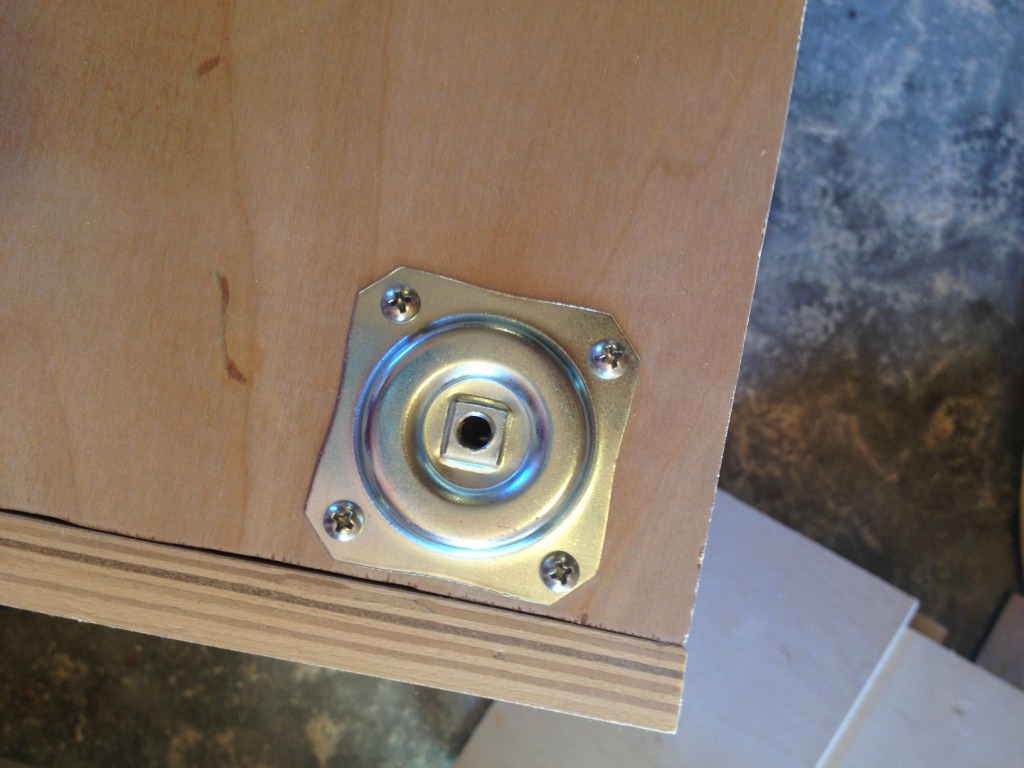 threaded foot mounting plate installed on bottom of cabinet