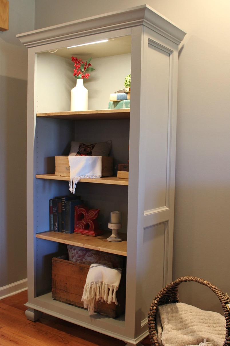 Simple traditional freestanding bookshelf standing in living room