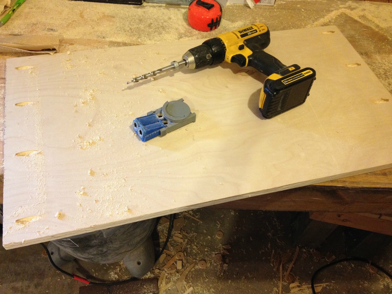 Pocket holes drilled in top and bottom panels of bookshelf