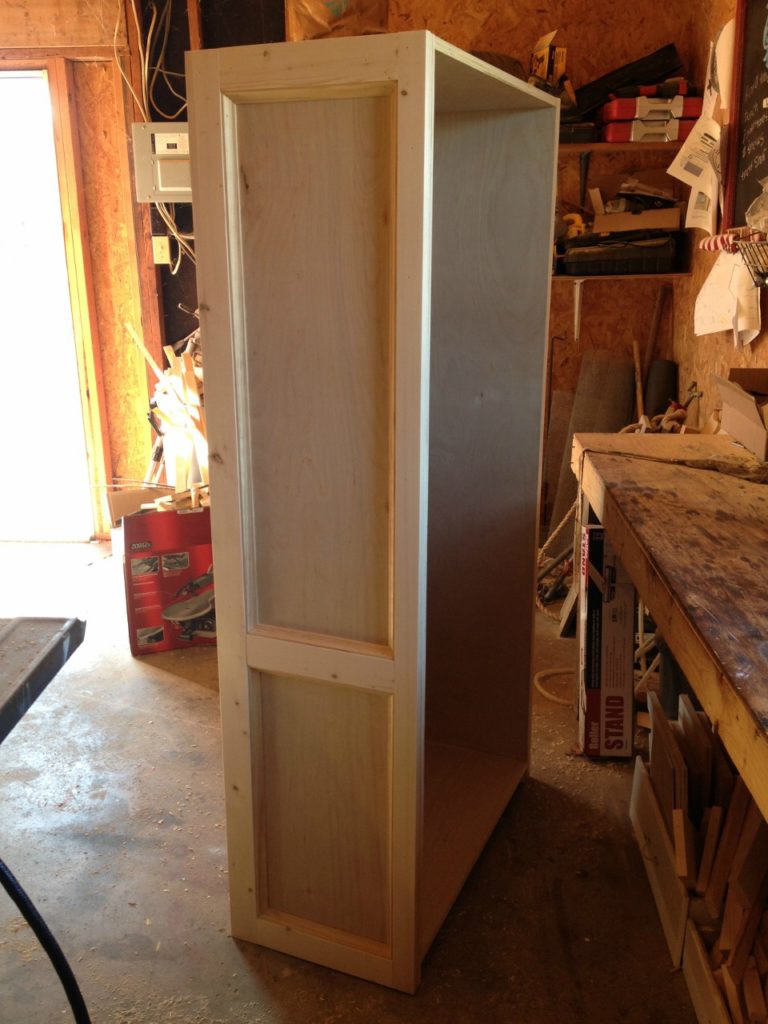 Side panel of bookshelf trimmed out with 1xs and cove molding
