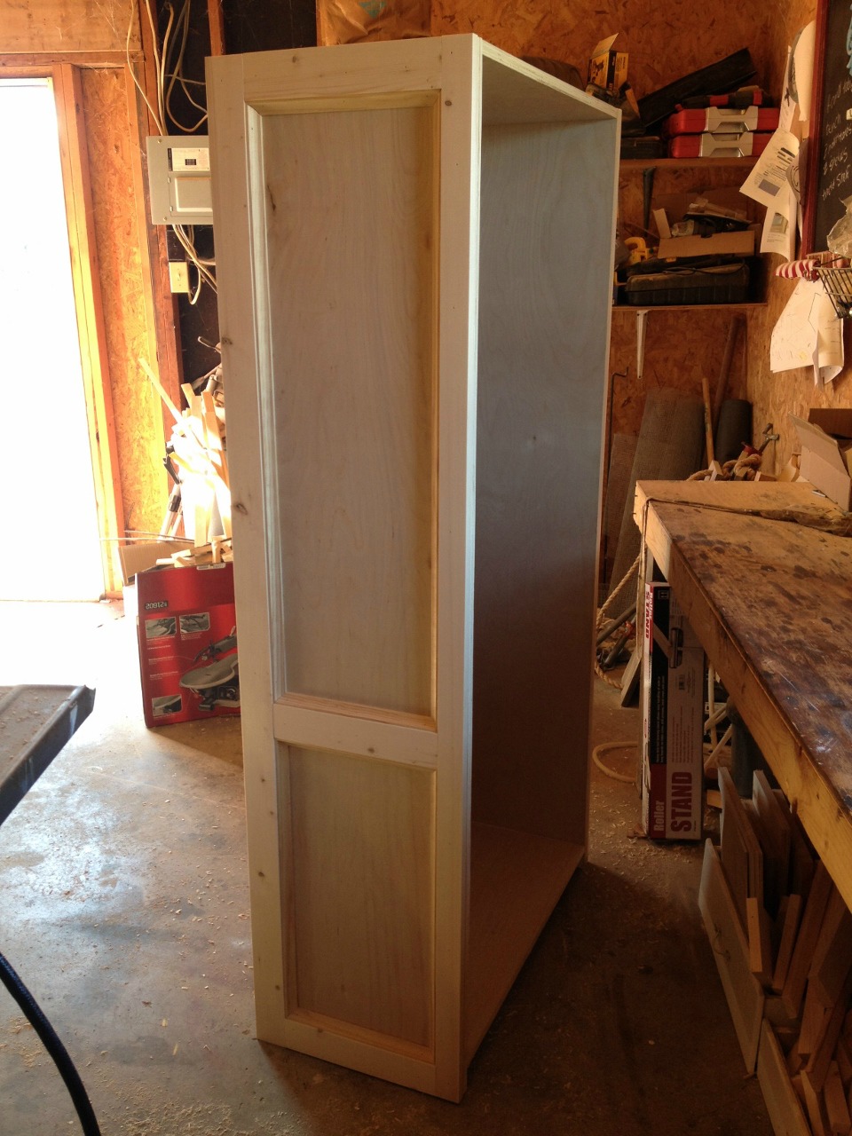 Side panel of bookshelf trimmed out with 1xs and cove molding