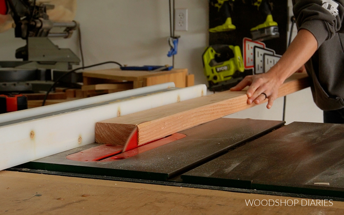 running 2x4 board through table saw to remove rounded edges