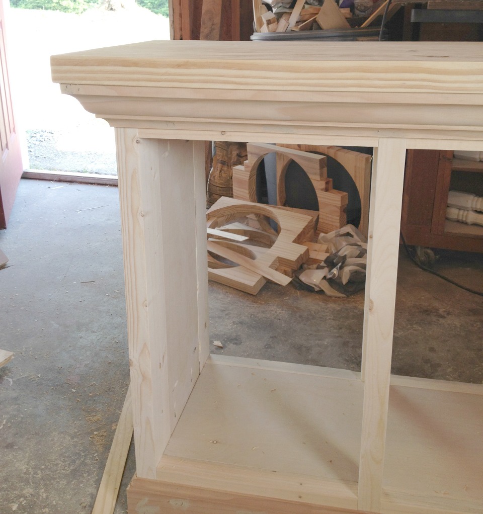 Crown molding added around top of aquarium cabinet stand