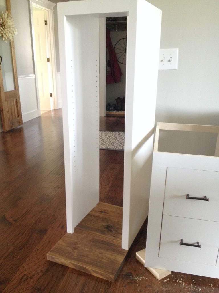 Open shelving cabinet carcass attached to countertop