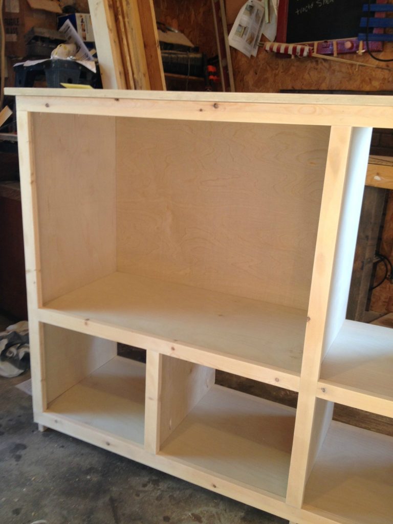 Face frame nailed in place on diy storage console cabinet