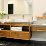 Free building plans to make your own modern DIY Floating bathroom vanity. Plenty of storage, clean straight lines and stained in Minwax Provincial, this gorgeous bathroom vanity will really make a statement in any DIY Bathroom remodel!