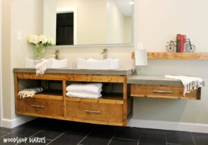 Free building plans to make your own modern DIY Floating bathroom vanity. Plenty of storage, clean straight lines and stained in Minwax Provincial, this gorgeous bathroom vanity will really make a statement in any DIY Bathroom remodel!