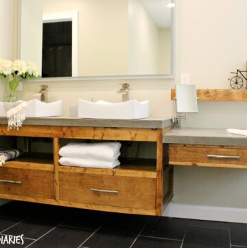 Free building plans to make your own modern DIY Floating bathroom vanity. Plenty of storage, clean straight lines and stained in Minwax Provincial, this gorgeous bathroom vanity will really make a statement in any DIY Bathroom remodel!