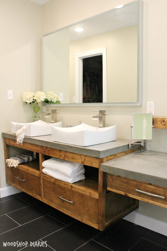 Floating bathroom vanity, Concrete counters, vessel sinks, and a small floating vanity for makeup too. Gorgeous modern style bathroom remodel