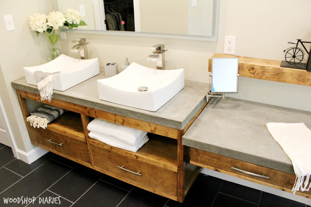 Modern bathroom with floating vanity and concrete countertops 