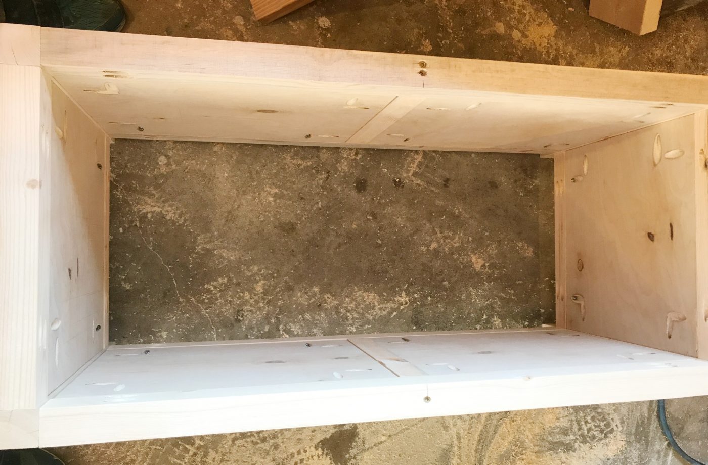 Add side panels to the DIY storage chest frame