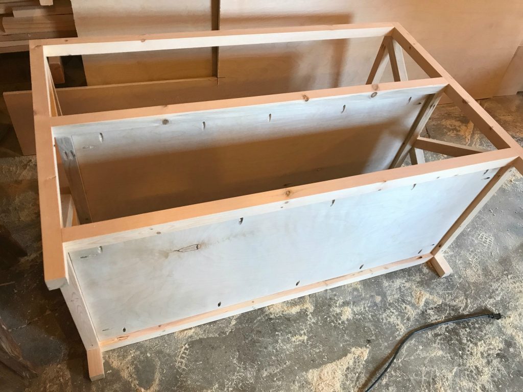 Add plywood shelves to x base console table