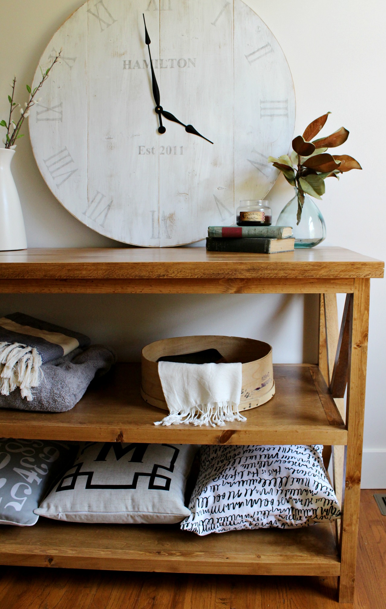 A clock on top of a wooden table