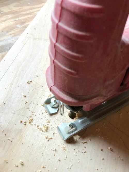 Cutting leaf pattern with jigsaw.