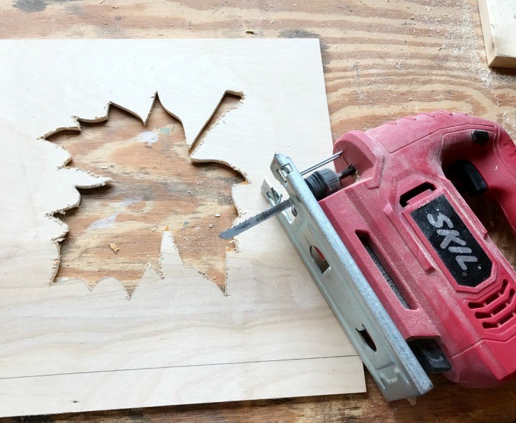 Leaf pattern cut out of plywood for scrap wood fall sign.