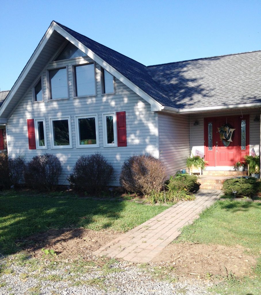 DIY Landscape Renovation with concrete curbing and white rock