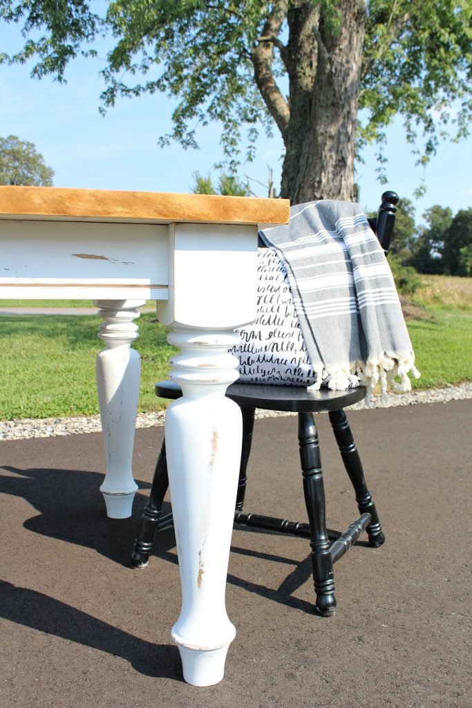 How to Build a DIY Farmhouse Dining Table with chunky turned legs--distressed white base and Minwax Early American top looks gorgeous together