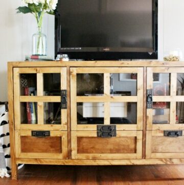 How to build your own DIY display media console cabinet and tv stand with drawer storage and glass panel doors! Get the free building plans here