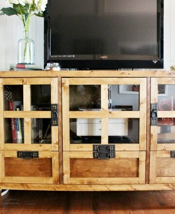 How to build your own DIY display media console cabinet and tv stand with drawer storage and glass panel doors! Get the free building plans here