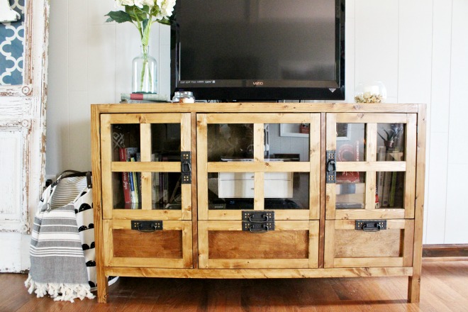 How to build your own DIY display media console cabinet and tv stand with drawer storage and glass panel doors! Get the free building plans here