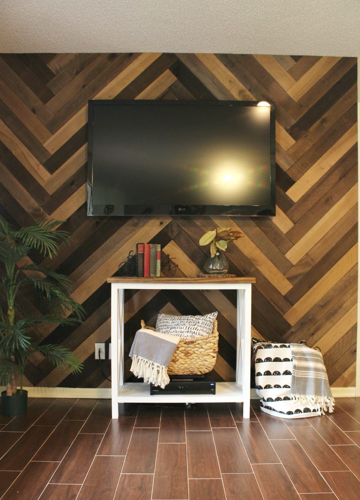 How to install a barn wood wall in a herringbone pattern. Gorgeous accent wall and it's so easy to do!