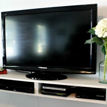 How to Build a Simple Floating TV Shelf with just enough storage!