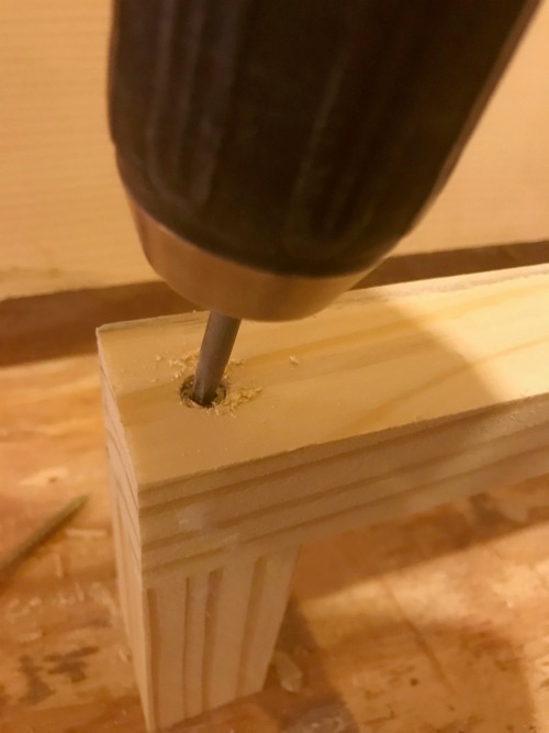 Screwing together 2x2s to make floating shelf bracket for hanging