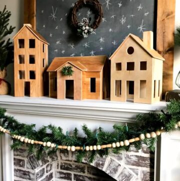 DIY Wooden Christmas Village Display perfect for a simple Scandinavian Christmas Mantle