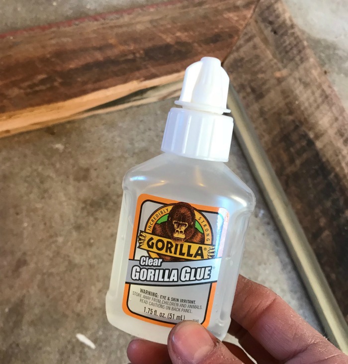 Use Clear Gorilla Glue to glue glass panels into barn wood picture frame