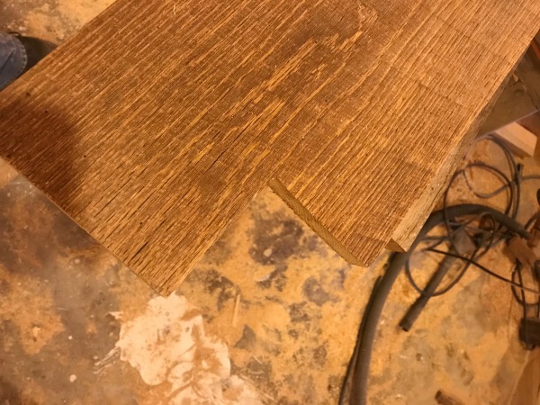 cut notches in barn wood top for table legs