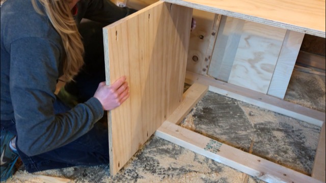 Shara Woodshop Diaries installing divider panel into DIY miter saw stand cabinet carcass