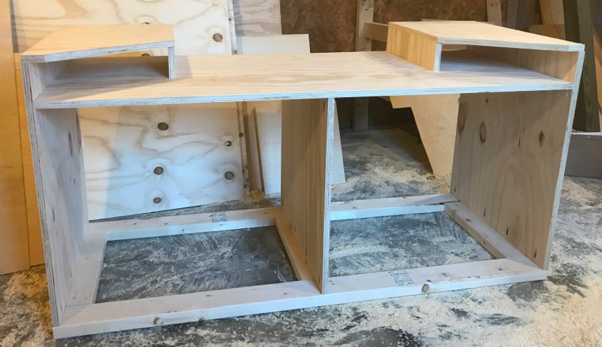 Miter saw station cabinet assembled with two cubbies at top