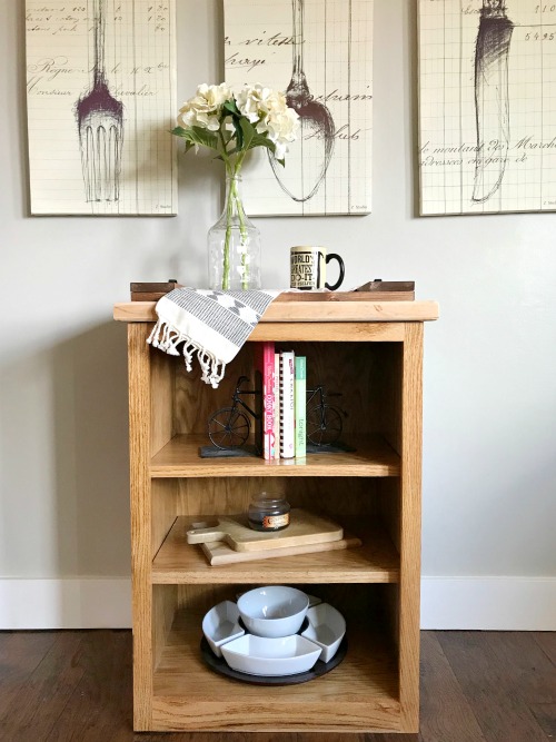 Simple little DIY stand alone bookshelf in kitchen with cookbooks