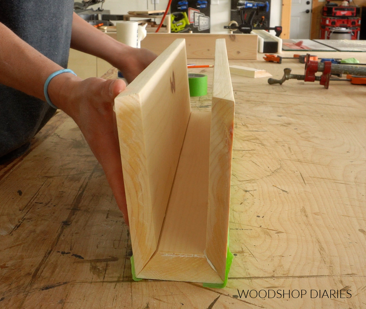 Shara Woodshop Diaries folding up floating shelf box on workbench
