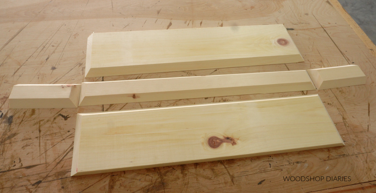 Pieces of floating shelf box laid out on workbench