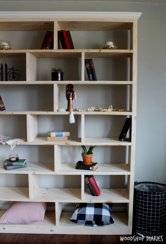 Simple, modern unfinished wooden DIY bookshelf with alternating shelf dividers