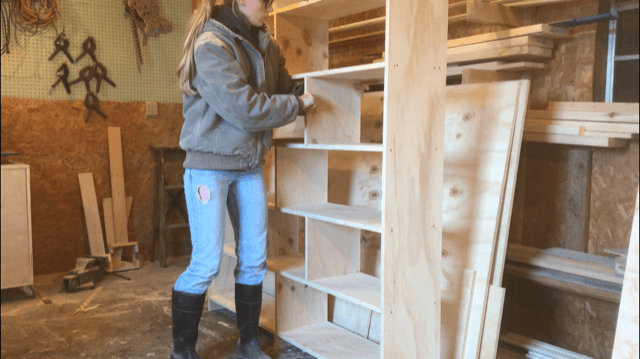 Installing bookshelf divider panels into modern DIY bookshelf