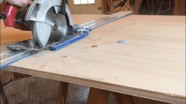 Cut plywood in half to build DIY bookshelf