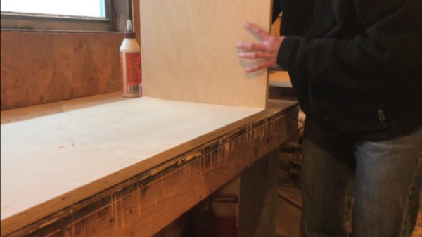 Fold up sides of DIY storage trunk to glue and nail joints together