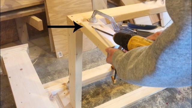 Attaching "feet" supports to back side of drawer framing on foot board