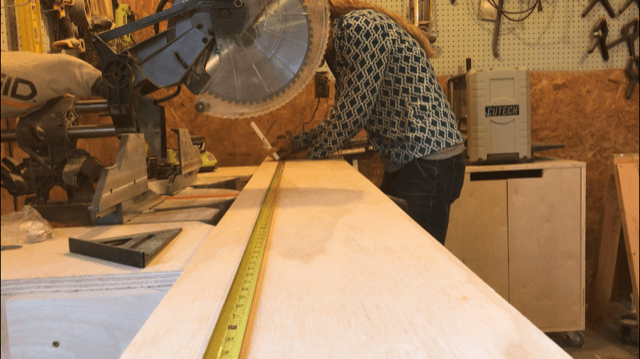 Measuring to cut plywood strip for bookshelf sides